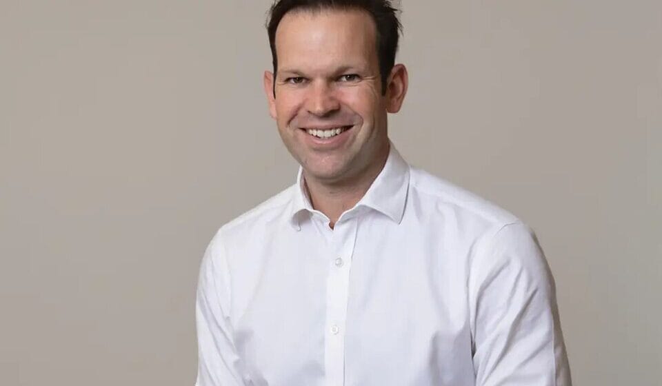 Matt Canavan seated in a white shirt against a grey background