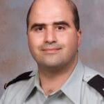 Nidal Malik Hasan wearing a US Army uniform in a 2007 portrait